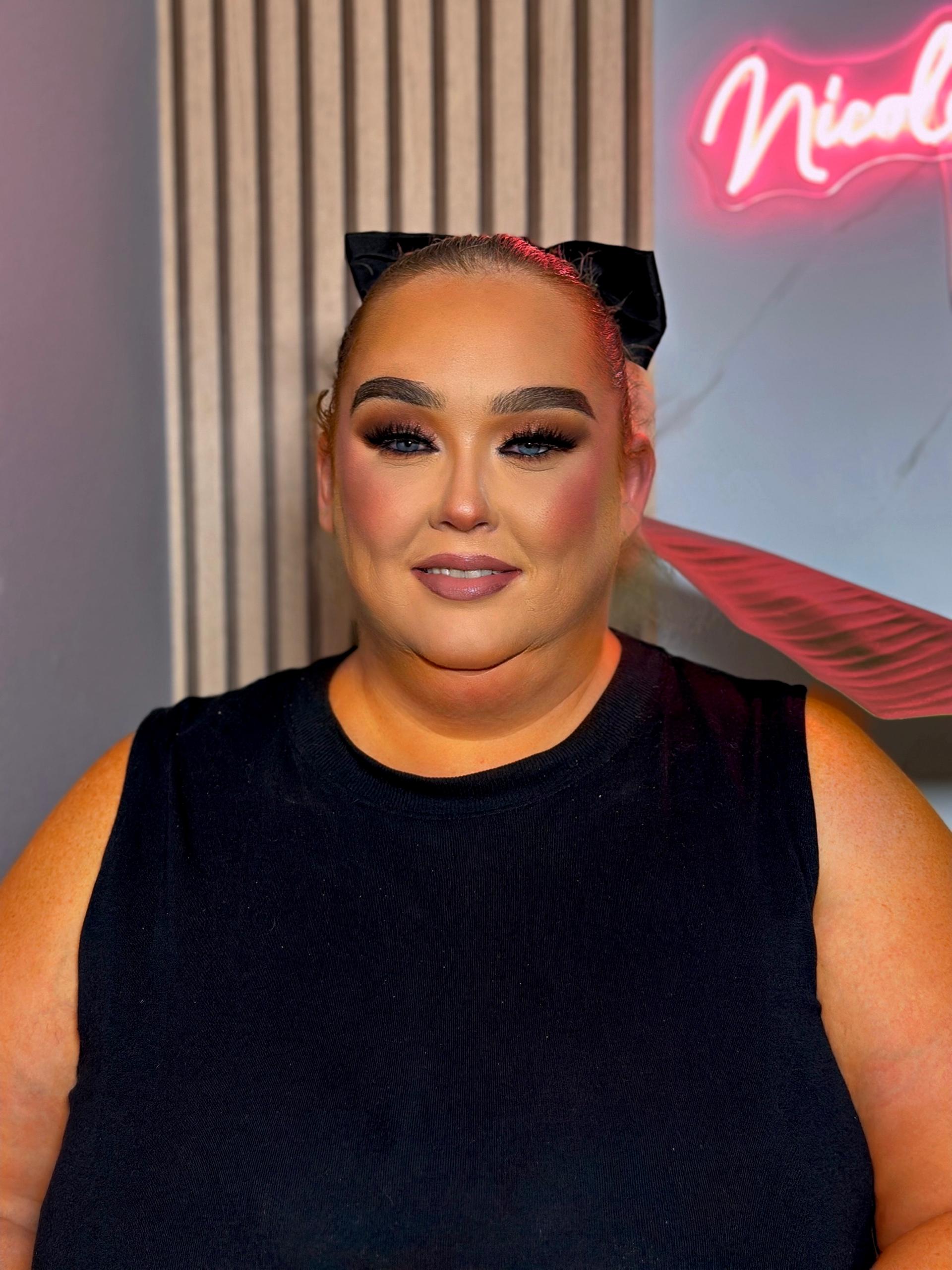 Smokey-eye glam with a bow headband